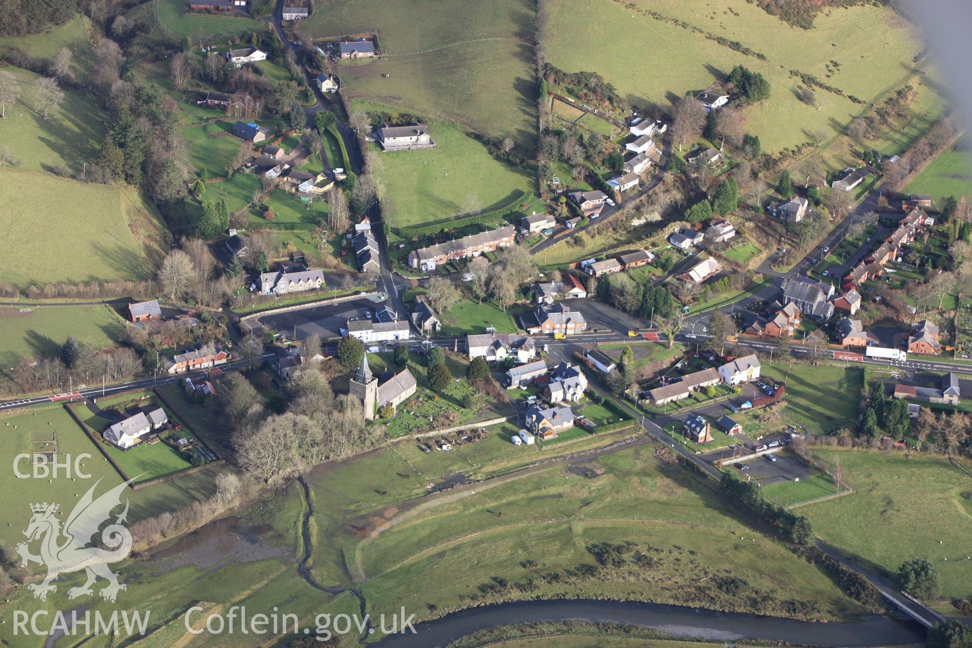 RCAHMW colour oblique aerial photograph of Llangurig village. Taken on 10 December 2009 by Toby Driver