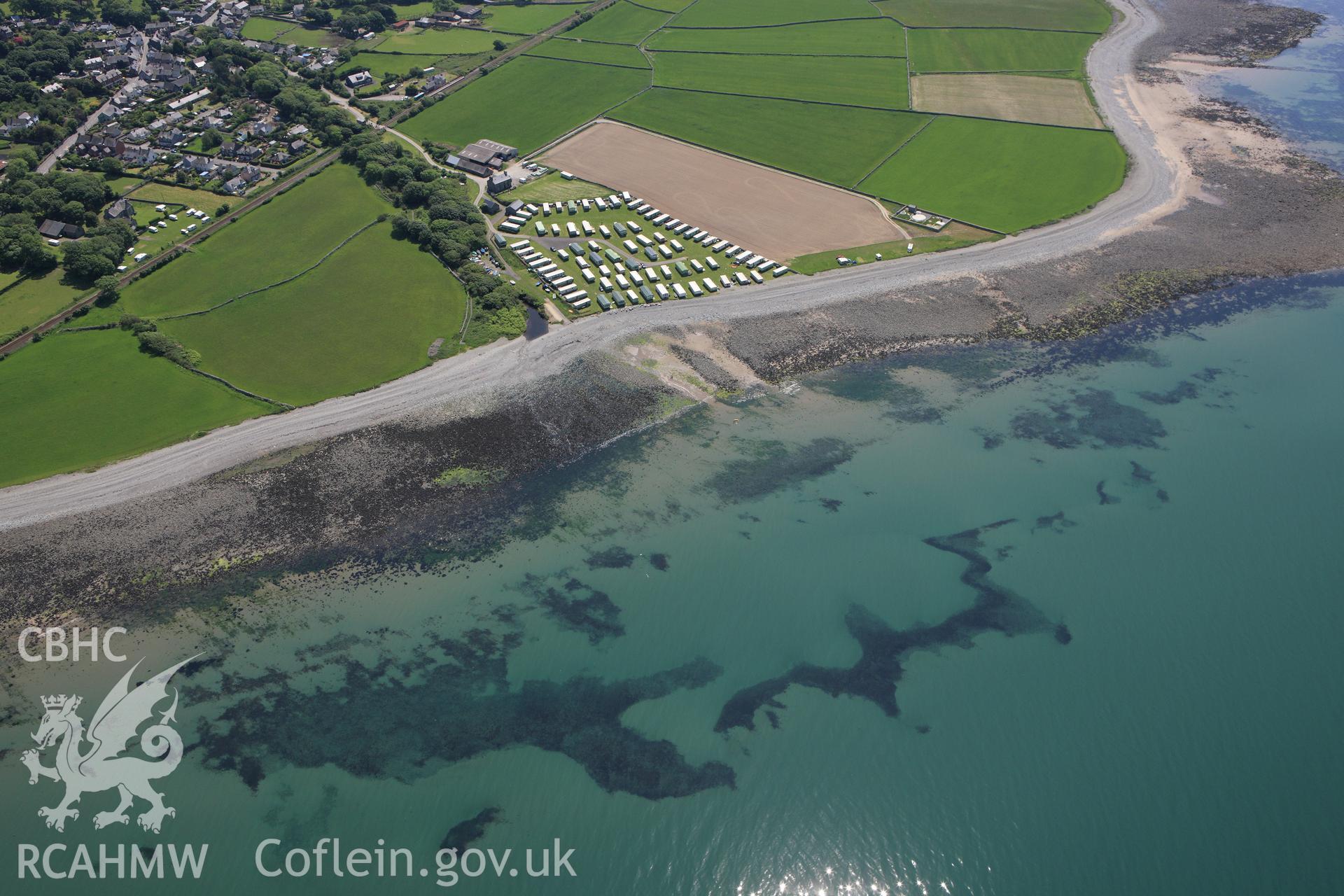 RCAHMW colour oblique aerial photograph of intertidal features near Llwyngwril Fish Trap I. Taken on 02 June 2009 by Toby Driver