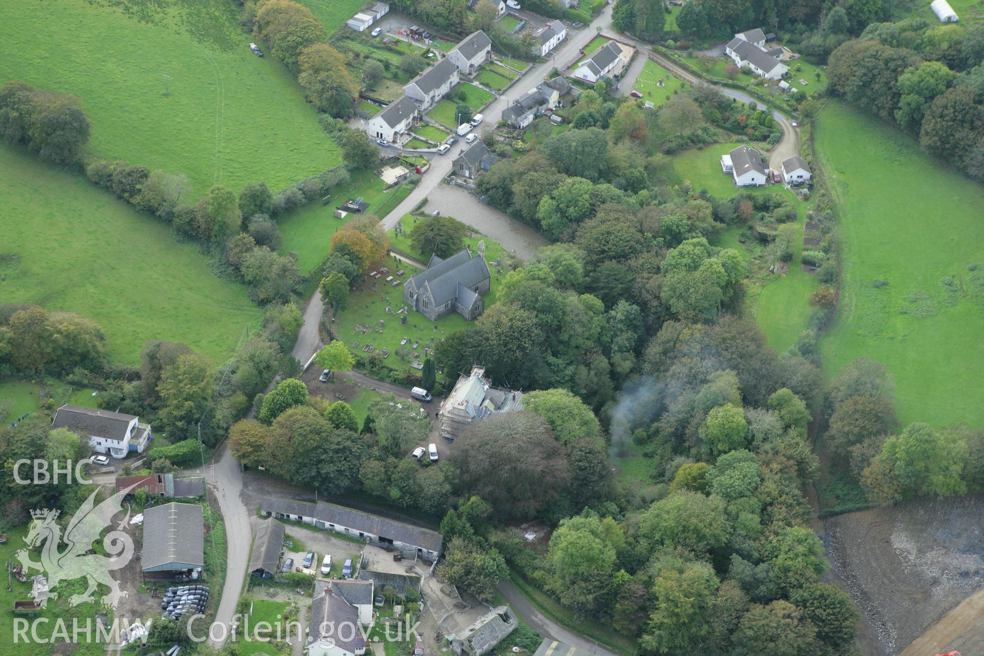 RCAHMW colour oblique aerial photograph of St Peter's Church and Lampeter Velfrey. Taken on 14 October 2009 by Toby Driver