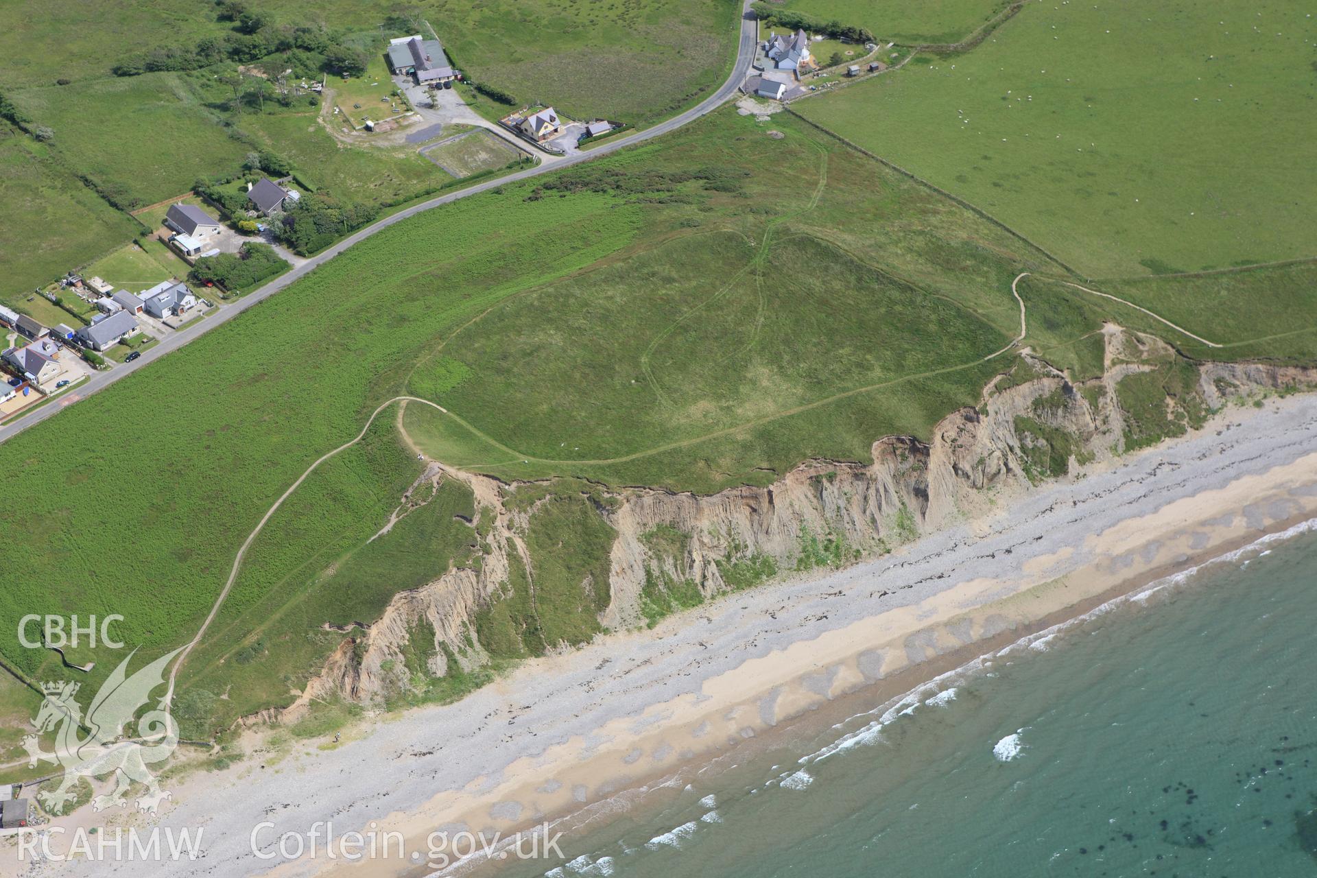 RCAHMW colour oblique aerial photograph of Dinas Dinlle Hillfort, Llandwrog. Taken on 16 June 2009 by Toby Driver