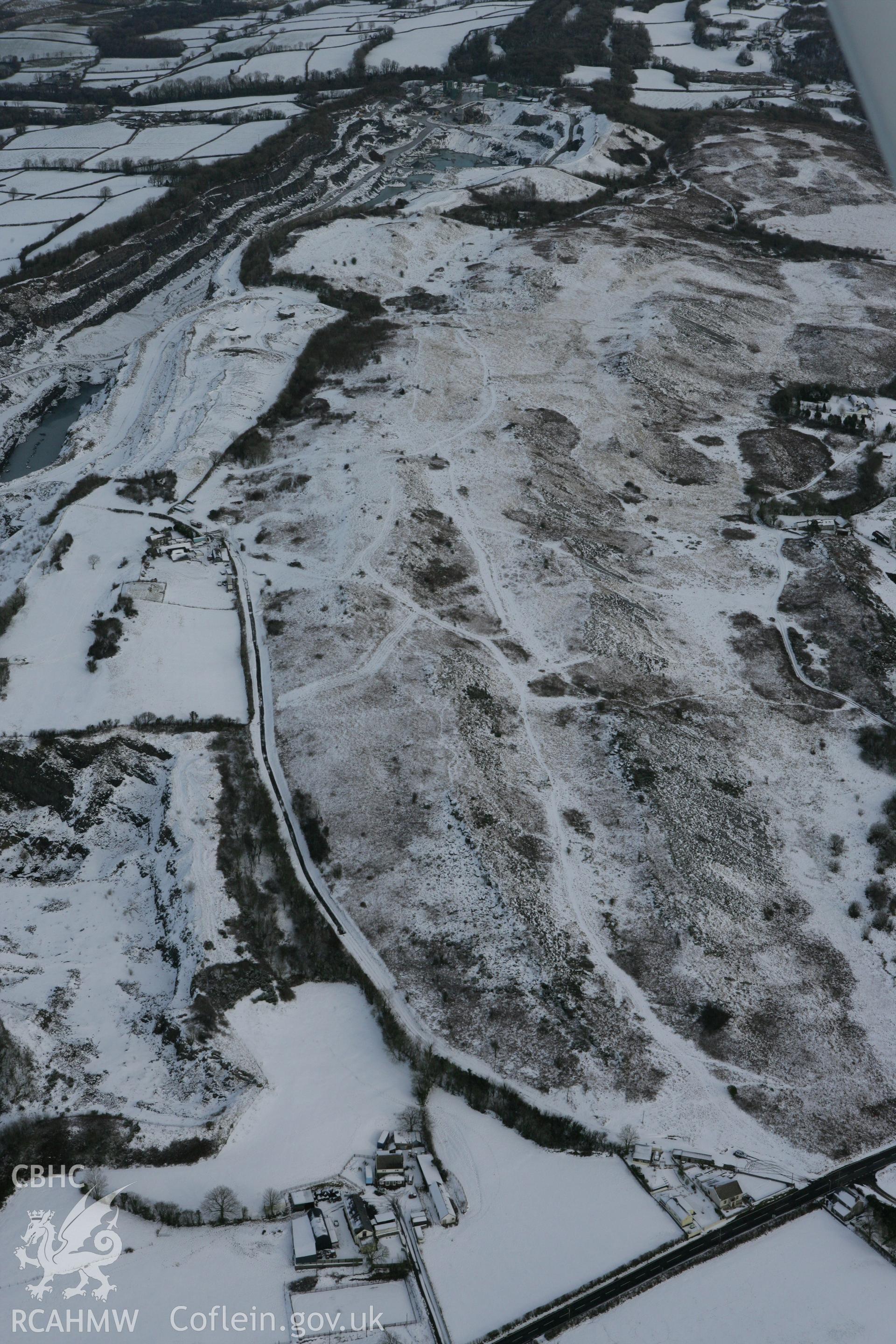 RCAHMW colour oblique photograph of Mynydd Llangynderyn cairns, looking east. Taken by Toby Driver on 06/02/2009.