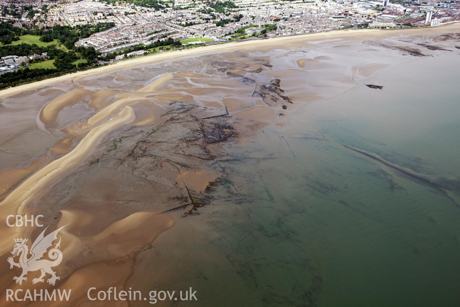 RCAHMW colour oblique aerial photograph of Swansea Bay Fish Traps. Taken on 09 July 2009 by Toby Driver