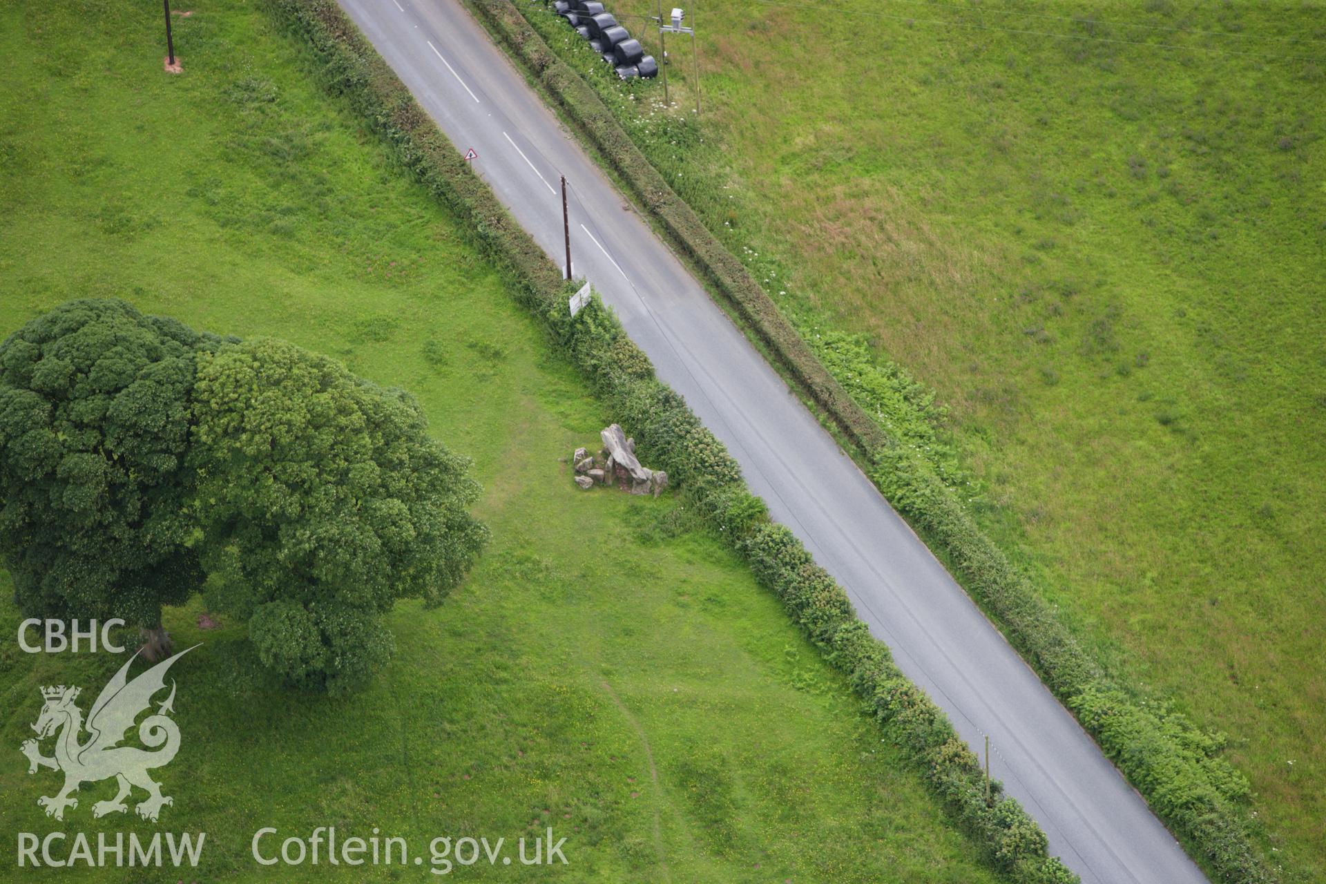 RCAHMW colour oblique aerial photograph of Gaerllwyd Burial Chamber. Taken on 09 July 2009 by Toby Driver