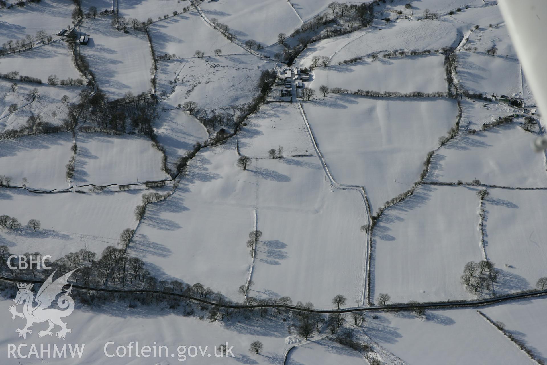 RCAHMW colour oblique photograph of Cwm-nant farm, with earthworks of former fields. Taken by Toby Driver on 06/02/2009.