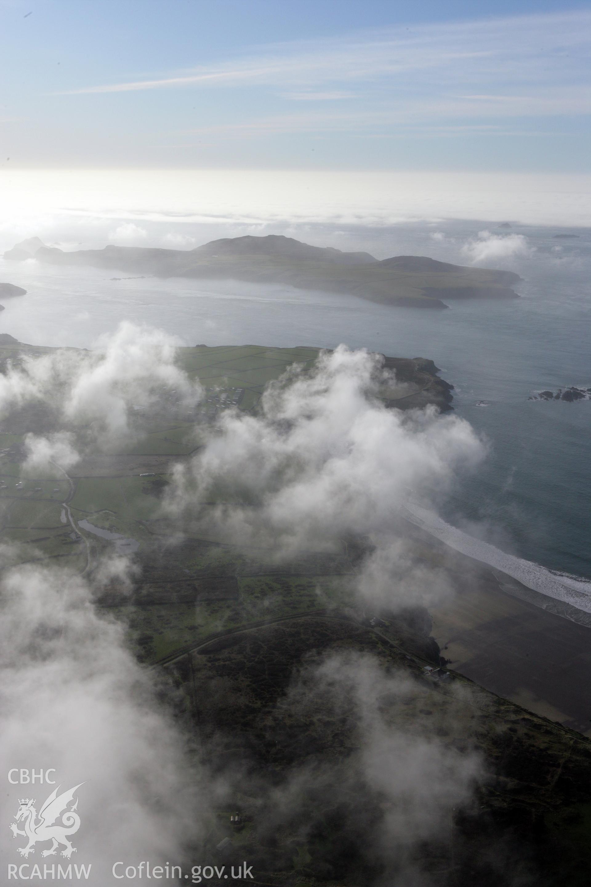 RCAHMW colour oblique aerial photograph of Whitesands Bay. A landscape view towards Ramsey Island, with clouds. Taken on 28 January 2009 by Toby Driver