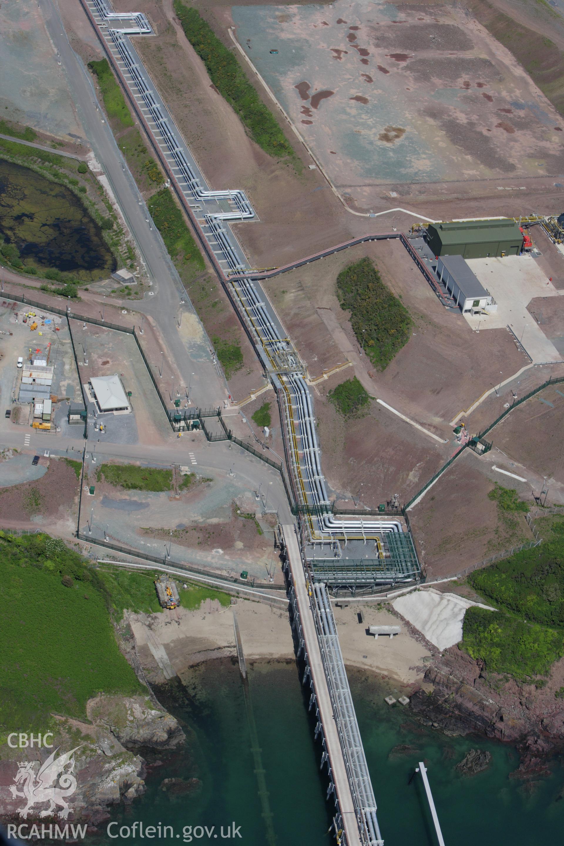 RCAHMW colour oblique aerial photograph of Esso South Hook Oil Refinery and liquid natural gas facility, Milford Haven. Taken on 01 June 2009 by Toby Driver