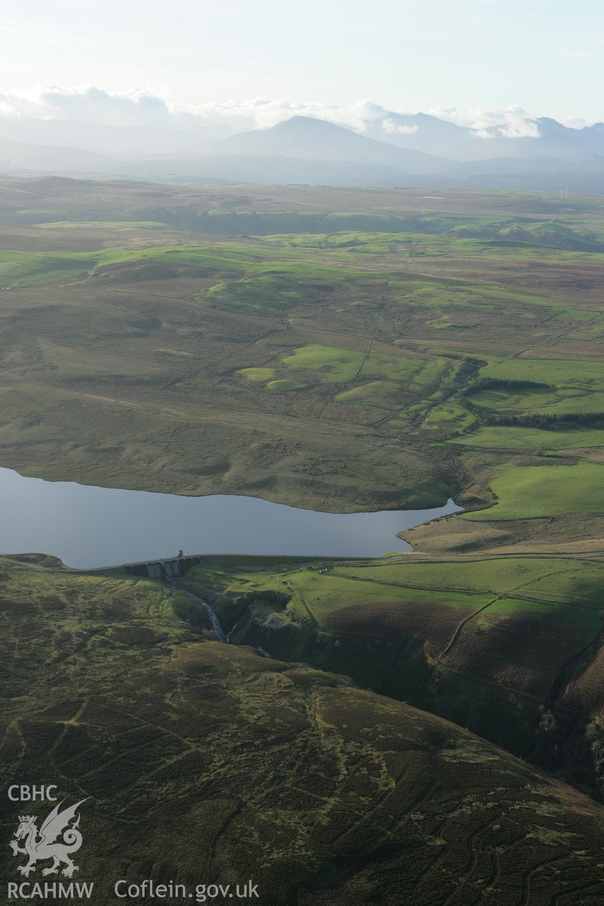 RCAHMW colour oblique aerial photograph showing landscape of Llyn Aled Isaf Mesolithic Occupation Site. Taken on 10 December 2009 by Toby Driver