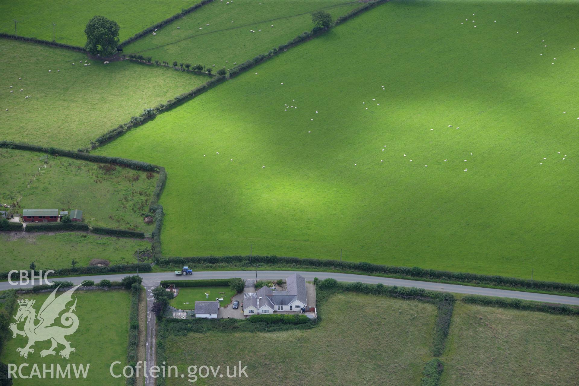 RCAHMW colour oblique aerial photograph of Plas Newydd Round Barrow. Taken on 30 July 2009 by Toby Driver