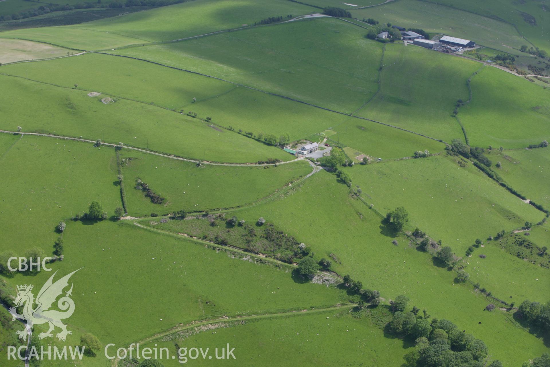 RCAHMW colour oblique aerial photograph of the landscape around Cwm Glo Farm. Taken on 02 June 2009 by Toby Driver
