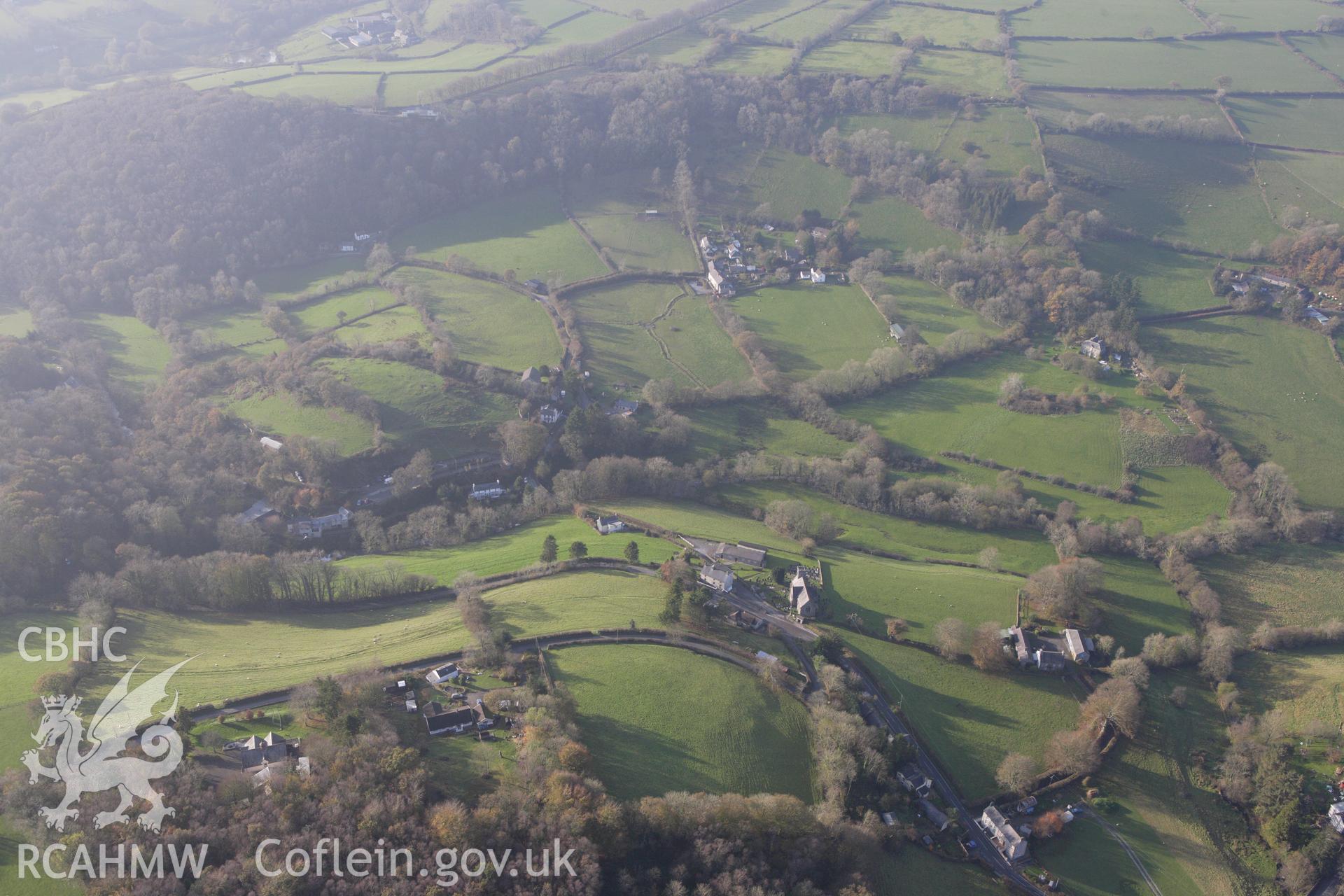 RCAHMW colour oblique aerial photograph of a defended enclosure at Capel Dewi. Taken on 09 November 2009 by Toby Driver