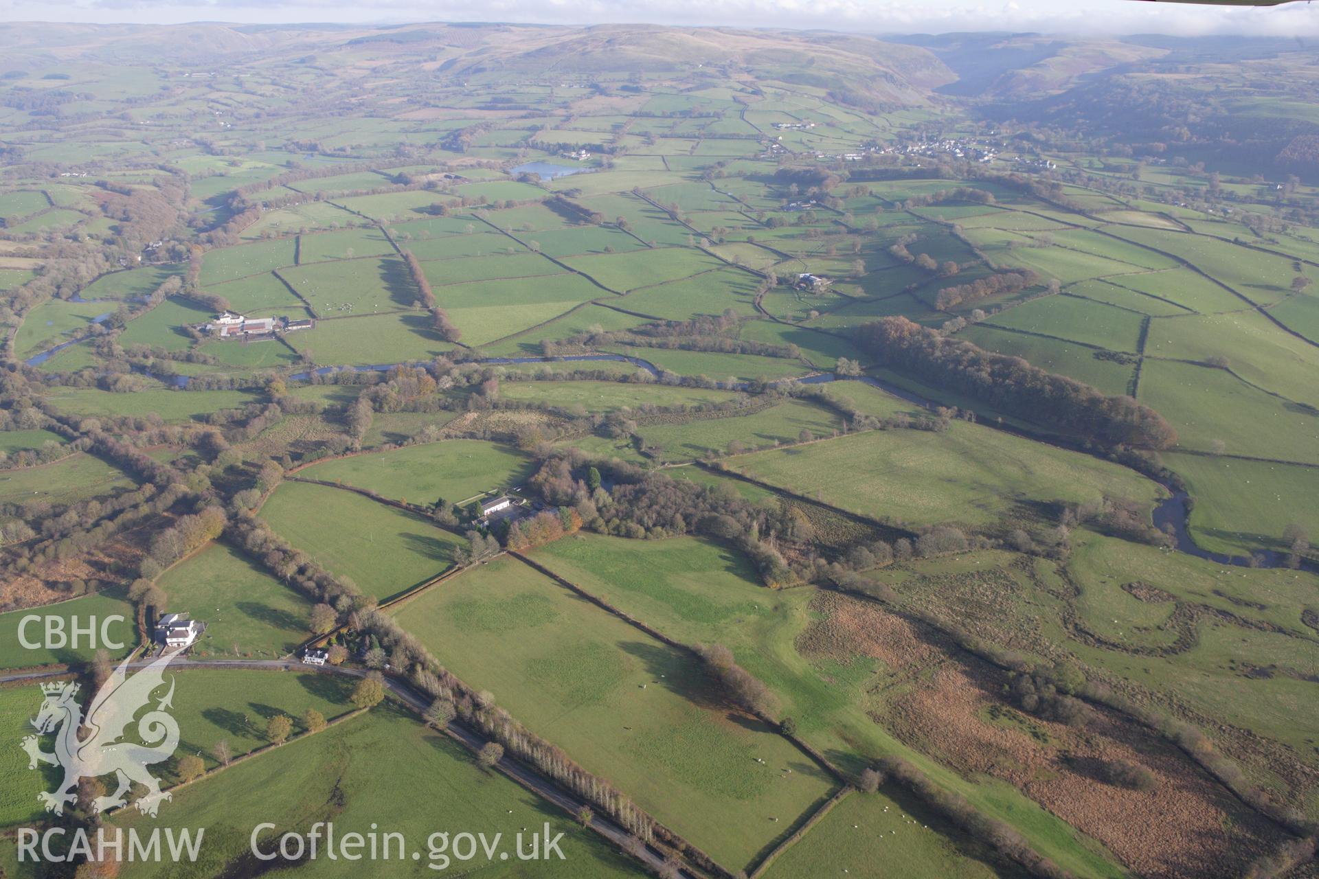 RCAHMW colour oblique aerial photograph of Llanio Roman Fort. Taken on 09 November 2009 by Toby Driver