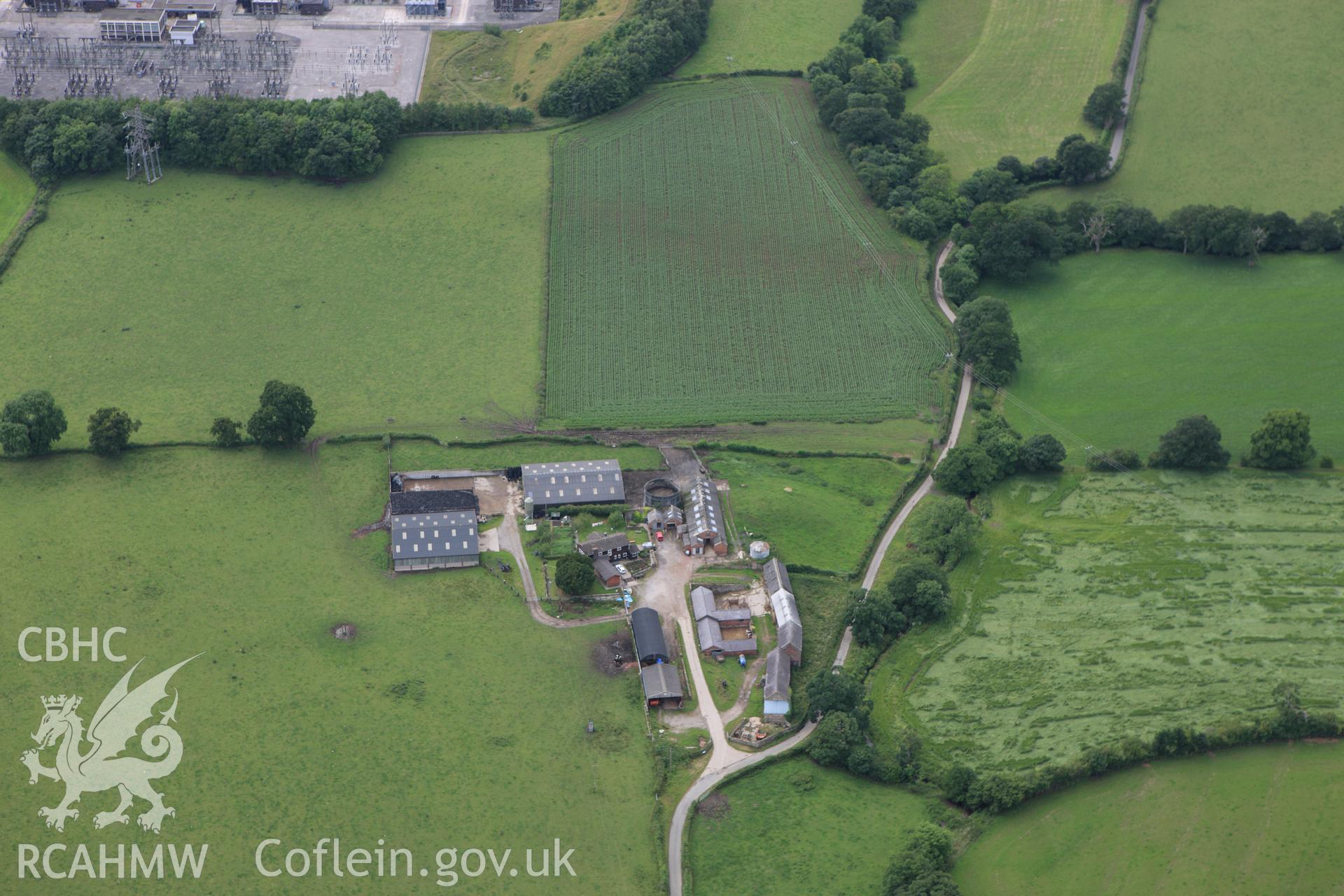 RCAHMW colour oblique aerial photograph of Cadwgan Hall Mound from the east. Taken on 08 July 2009 by Toby Driver
