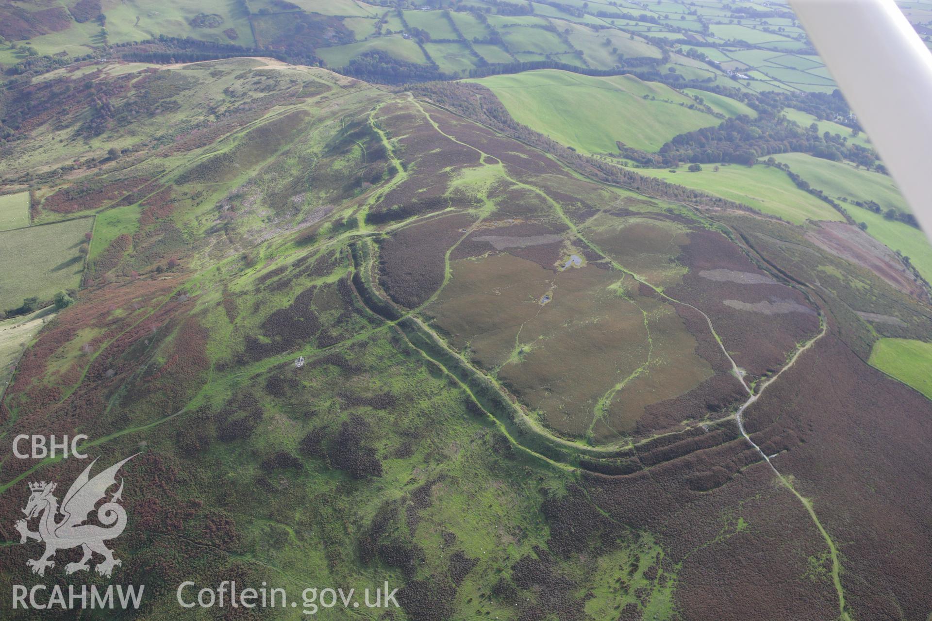 RCAHMW colour oblique aerial photograph of Penycloddiau Hillfort. Taken on 13 October 2009 by Toby Driver