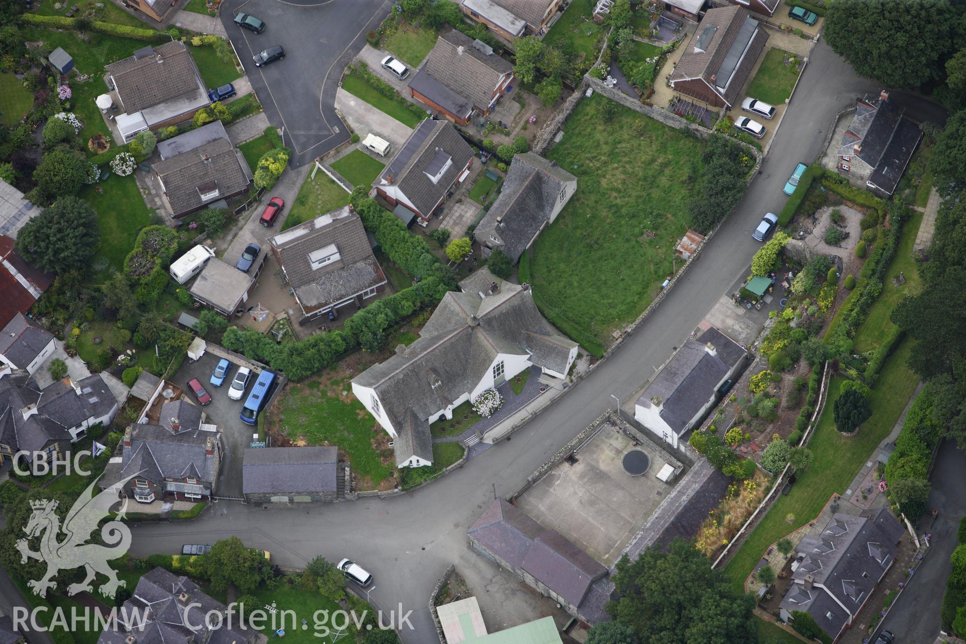 RCAHMW colour oblique aerial photograph of Church Institute, Park Road, Llanfairfechan. Taken on 06 August 2009 by Toby Driver