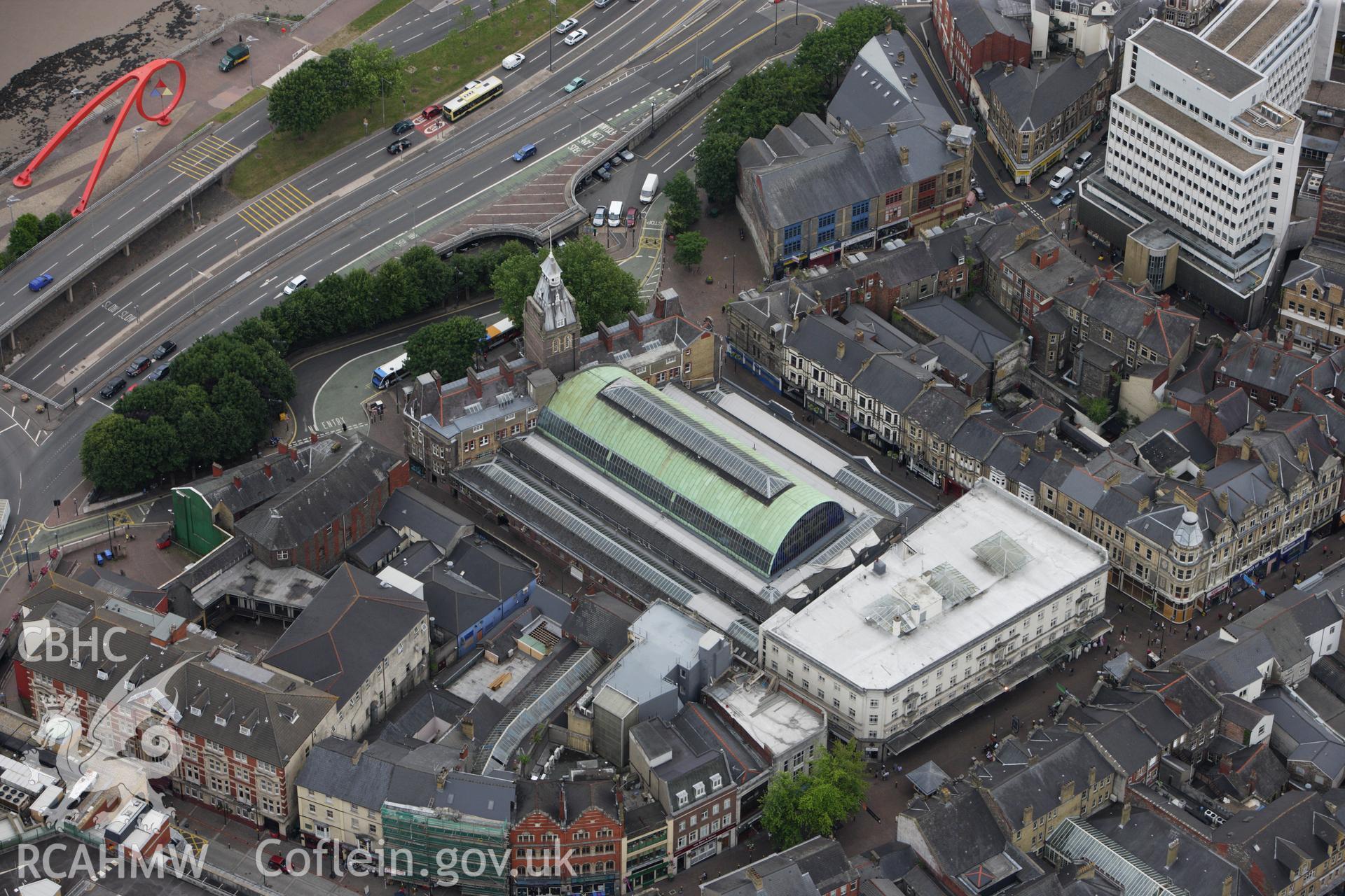 RCAHMW colour oblique aerial photograph of Newport Market, Upper Dock Street and High Street, Newport. Taken on 09 July 2009 by Toby Driver