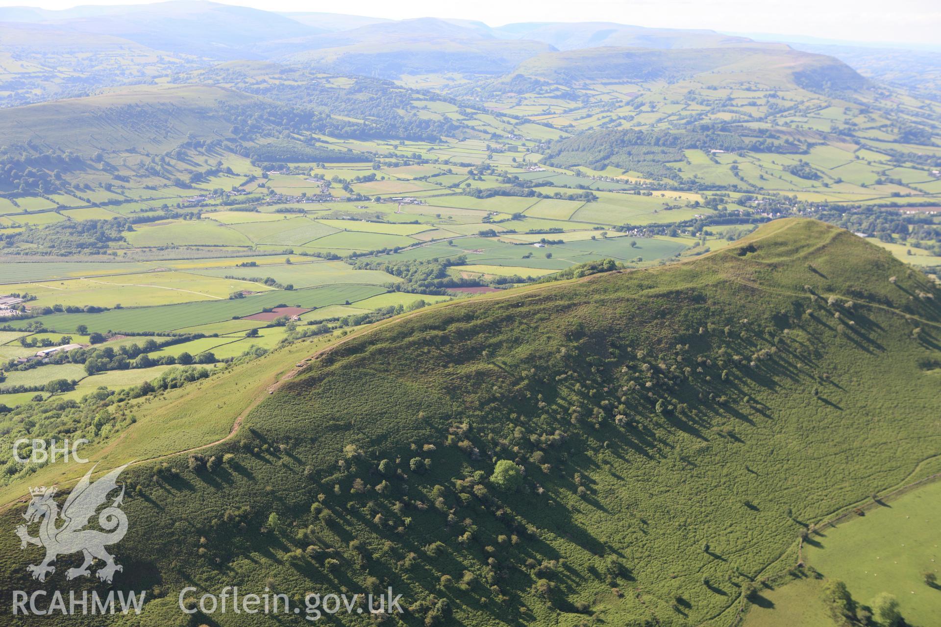 RCAHMW colour oblique aerial photograph of Skirrid Fawr Summit Enclosure. Taken on 11 June 2009 by Toby Driver