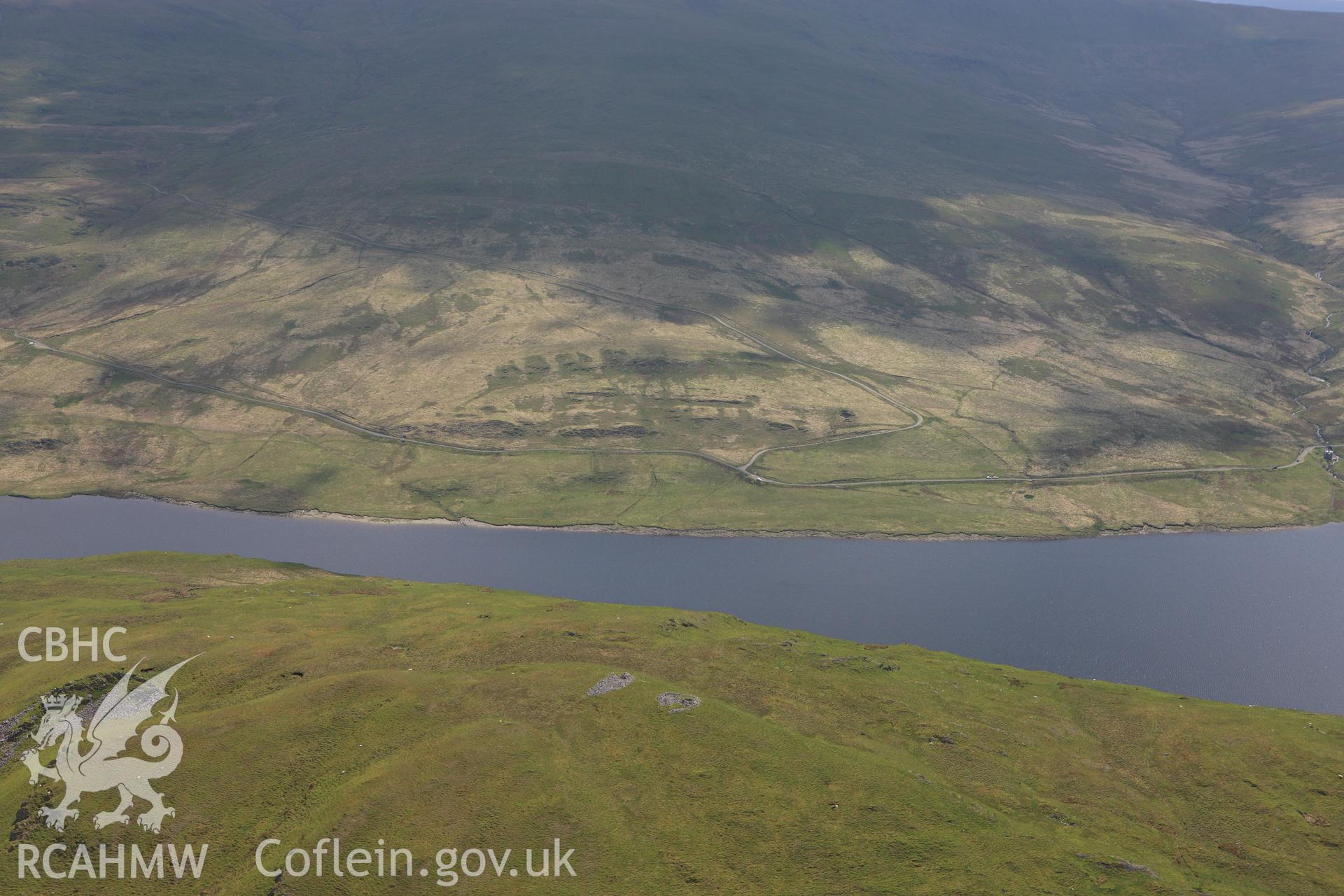 RCAHMW colour oblique aerial photograph of Drosgol Carneddau Cairns I and II. Taken on 02 June 2009 by Toby Driver