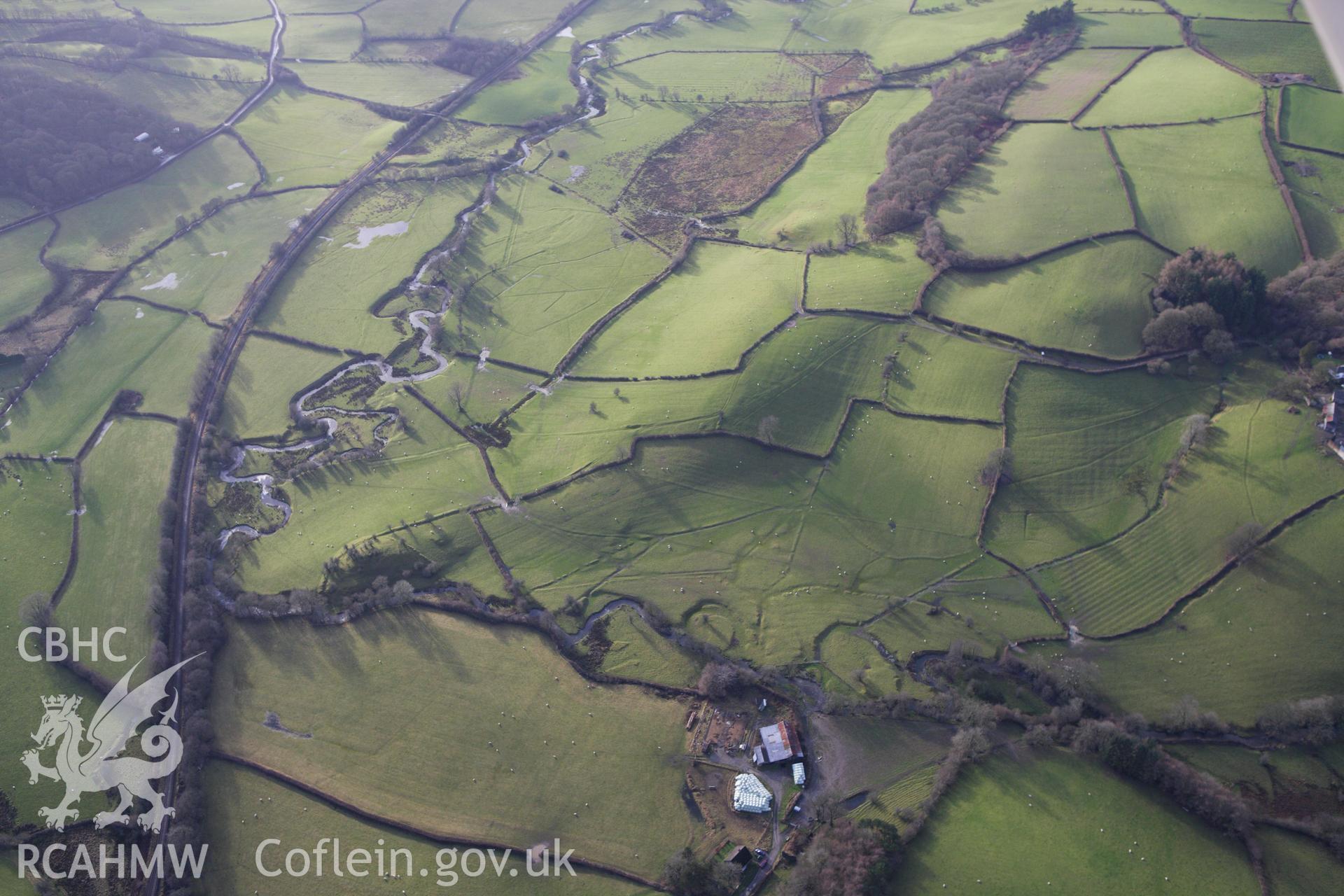 RCAHMW colour oblique aerial photograph of former field system earthworks south of Lower Pentre Farm. Taken on 10 December 2009 by Toby Driver