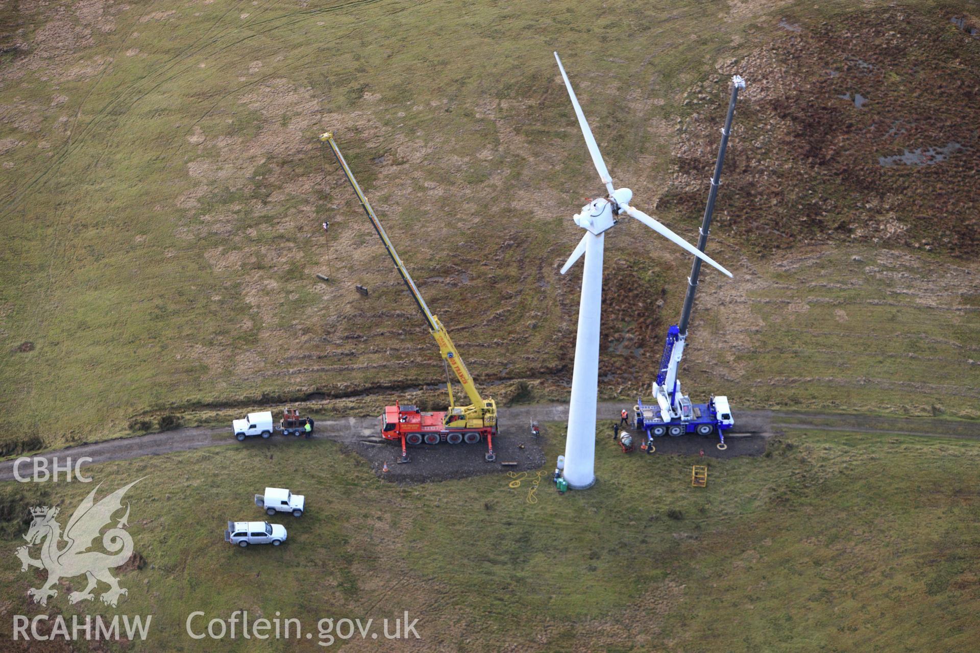 RCAHMW colour oblique aerial photograph of repair works at Dethenydd Wind Farm. Taken on 10 December 2009 by Toby Driver
