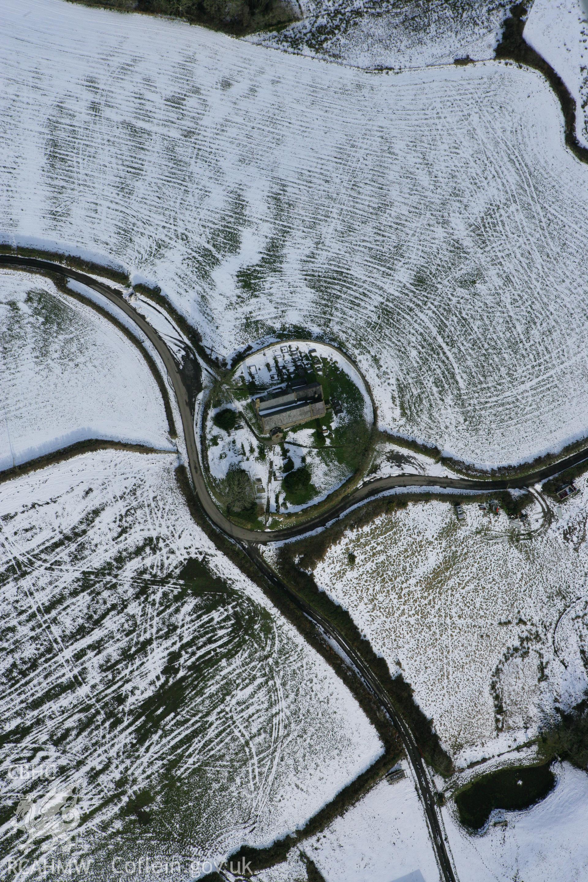 RCAHMW colour oblique photograph of St Cynog's church. Taken by Toby Driver on 06/02/2009.
