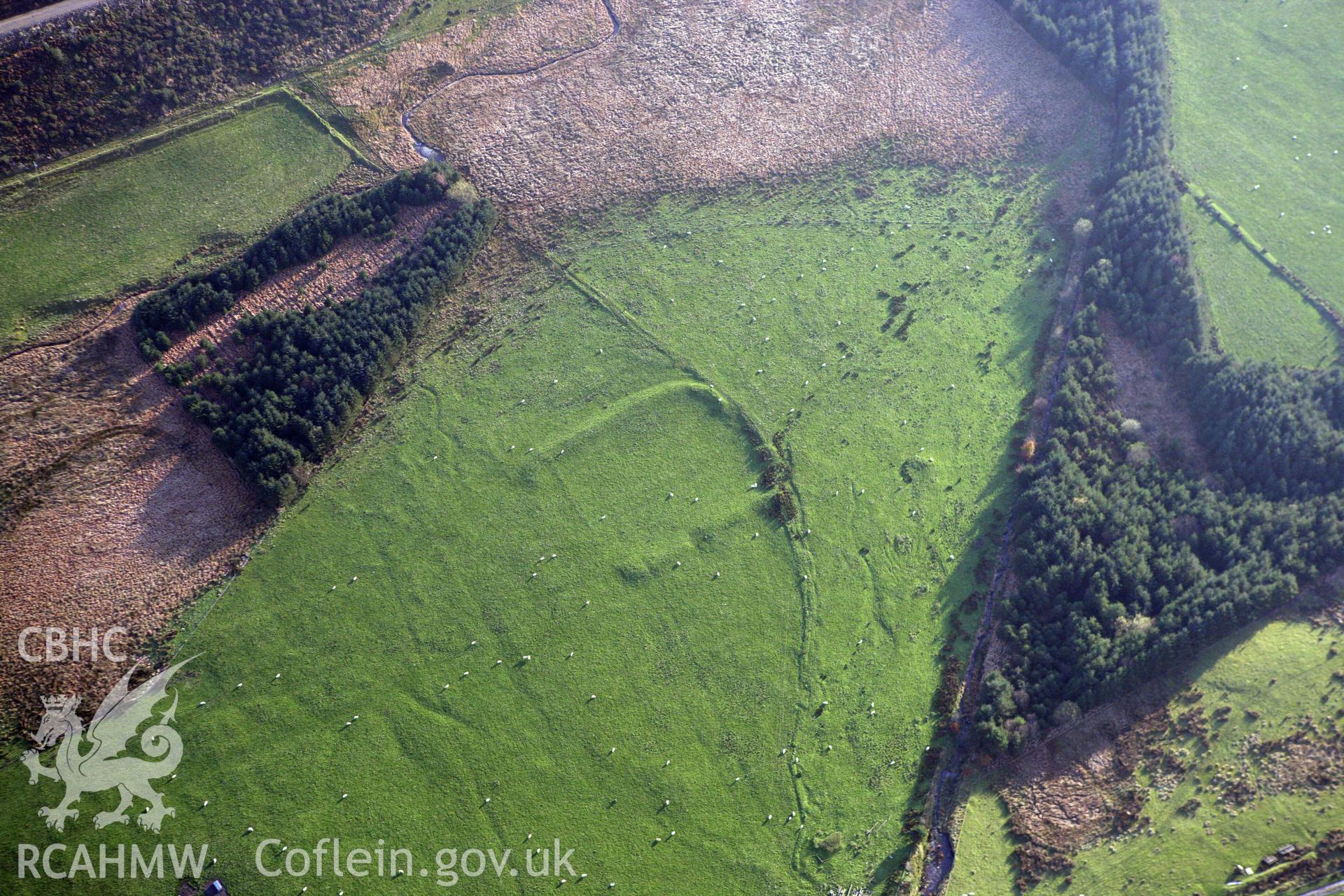 RCAHMW colour oblique aerial photograph of Llys Arthur earthwork. Taken on 09 November 2009 by Toby Driver