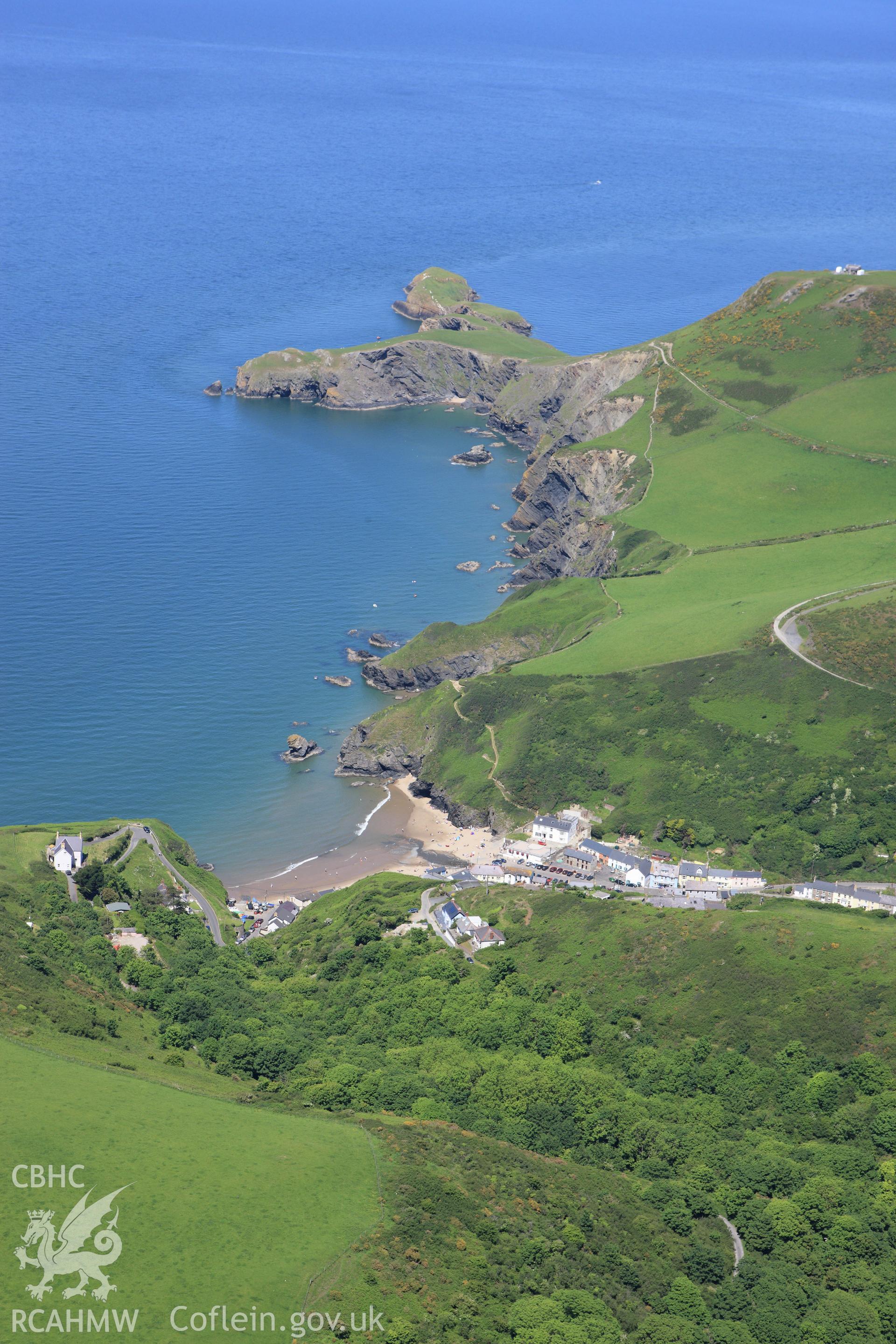 RCAHMW colour oblique aerial photograph of Llangrannog. Taken on 01 June 2009 by Toby Driver