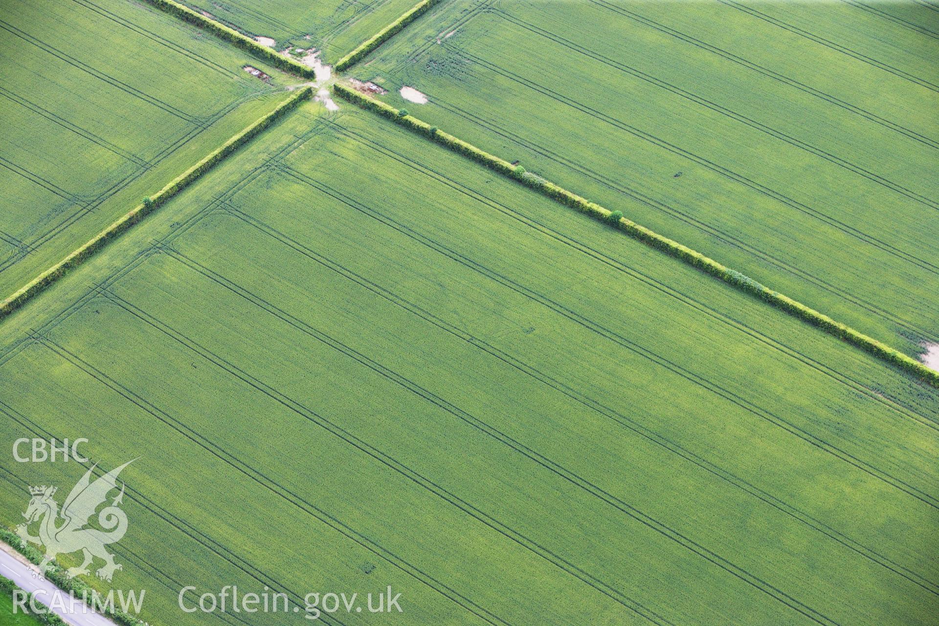 RCAHMW colour oblique aerial photograph of Llancayo Farm Roman Marching Camp. Taken on 09 July 2009 by Toby Driver
