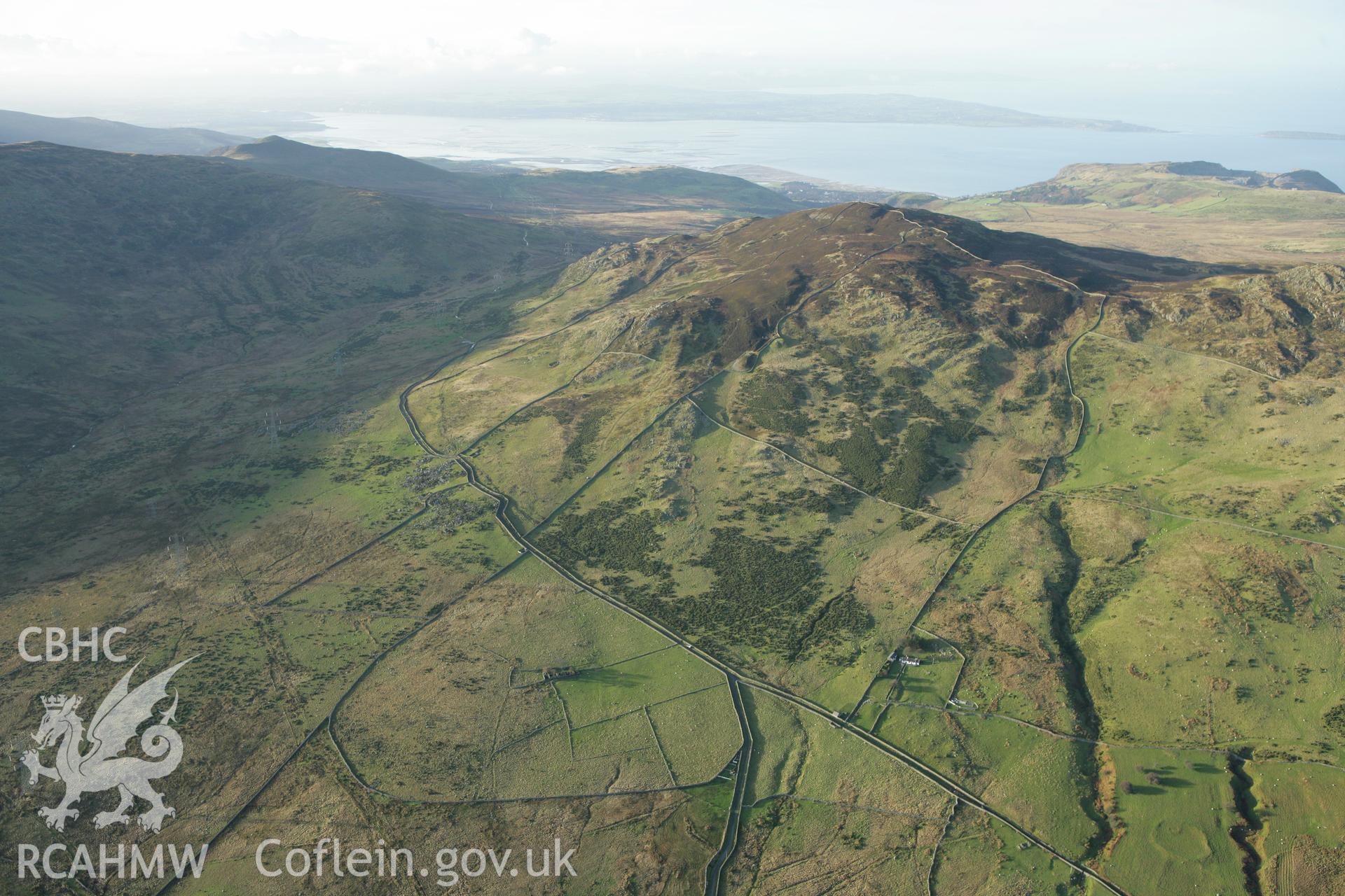 RCAHMW colour oblique aerial photograph of Tan-y-Braich Farmstead and surrounding landscape. Taken on 10 December 2009 by Toby Driver