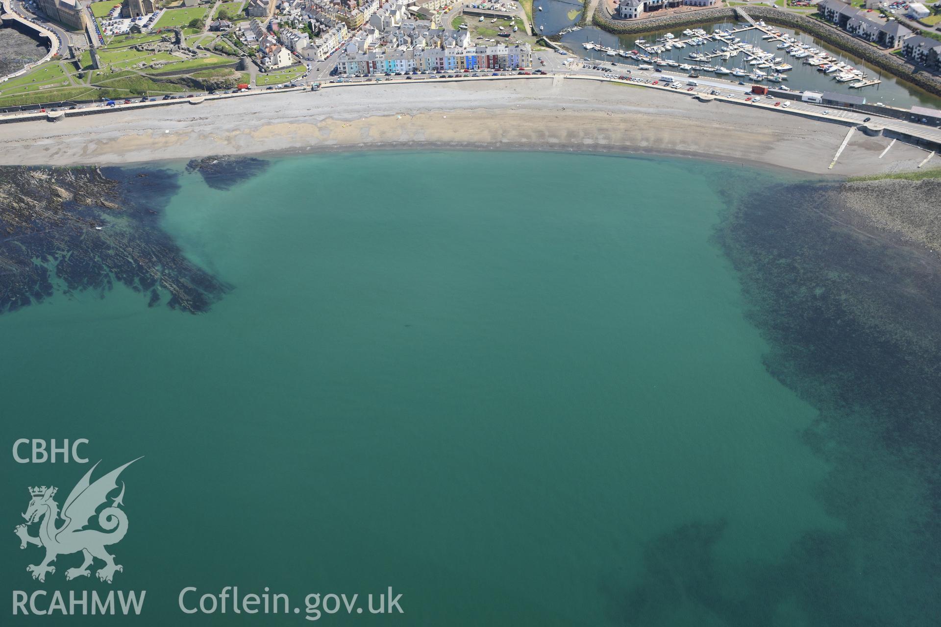 RCAHMW colour oblique aerial photograph of South Beach Aberystwyth, showing a possible wreck. Taken on 02 June 2009 by Toby Driver