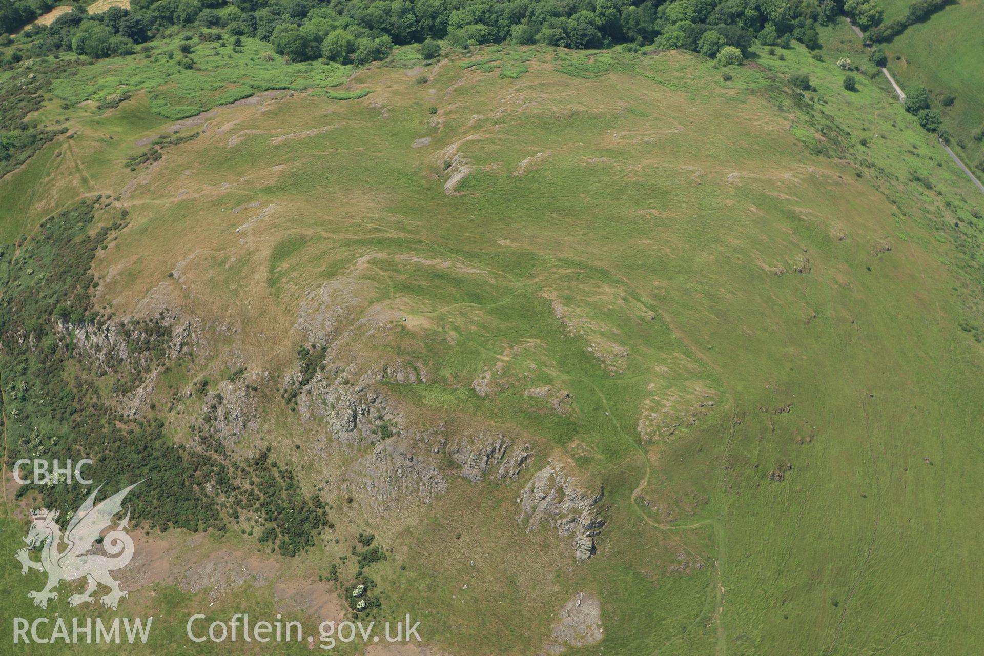 RCAHMW colour oblique aerial photograph of Roundton Enclosure. Taken on 29 June 2009 by Toby Driver