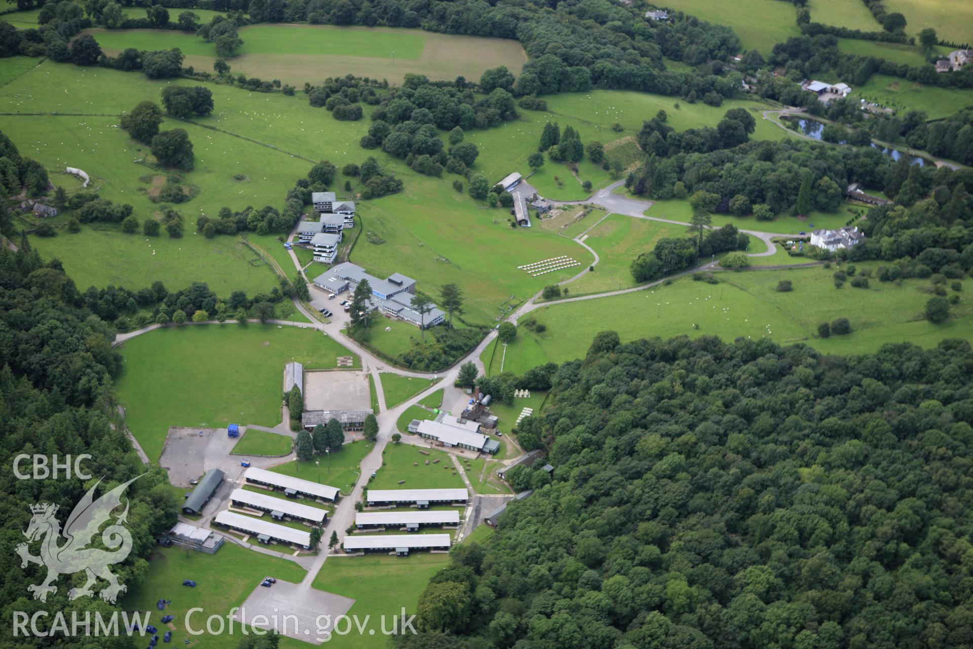RCAHMW colour oblique aerial photograph of Loggerheads Country Park Visitor Centre, and outdoor education centre. Taken on 30 July 2009 by Toby Driver