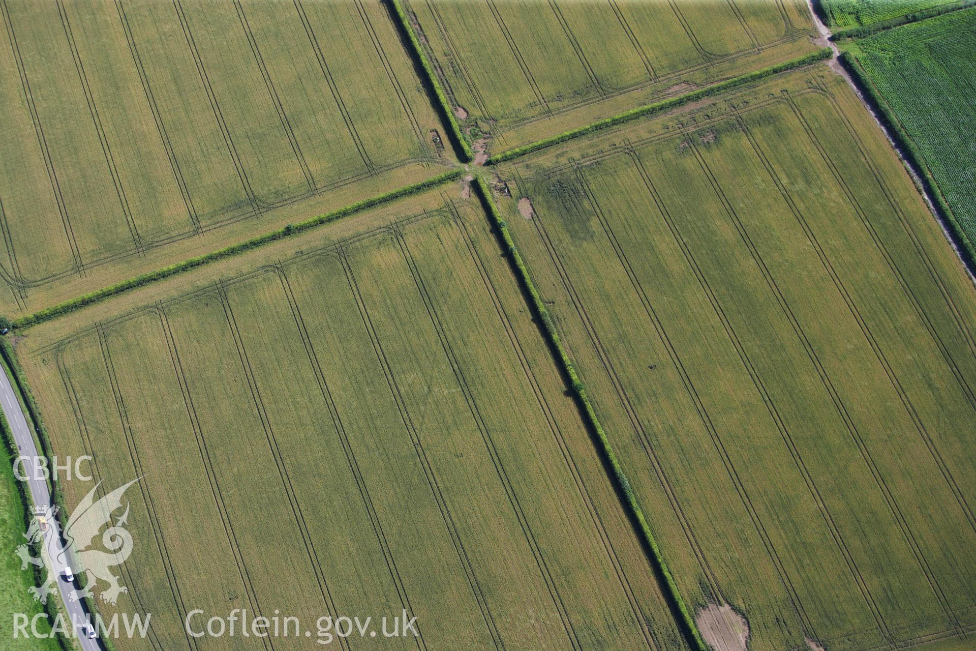 RCAHMW colour oblique aerial photograph of Llancayo Farm Roman Marching Camp and barrows. Taken on 23 July 2009 by Toby Driver