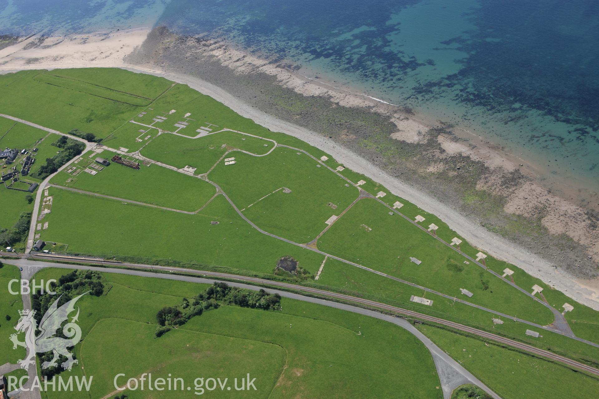 RCAHMW colour oblique aerial photograph of Tonfanau Camp Earthwork. Taken on 02 June 2009 by Toby Driver