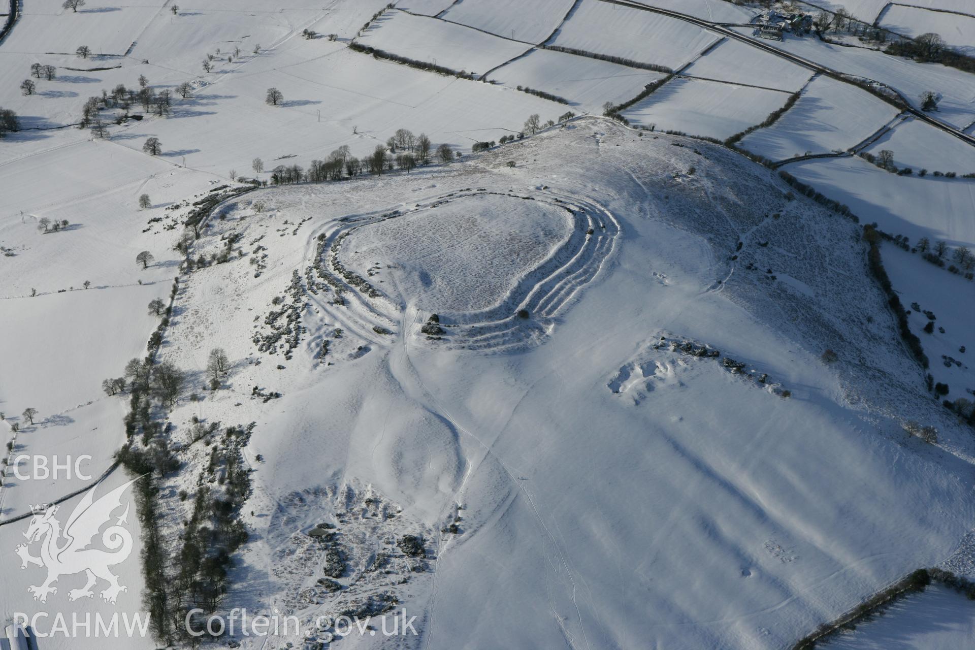 RCAHMW colour oblique photograph of Pen y Crug hillfort. Taken by Toby Driver on 06/02/2009.