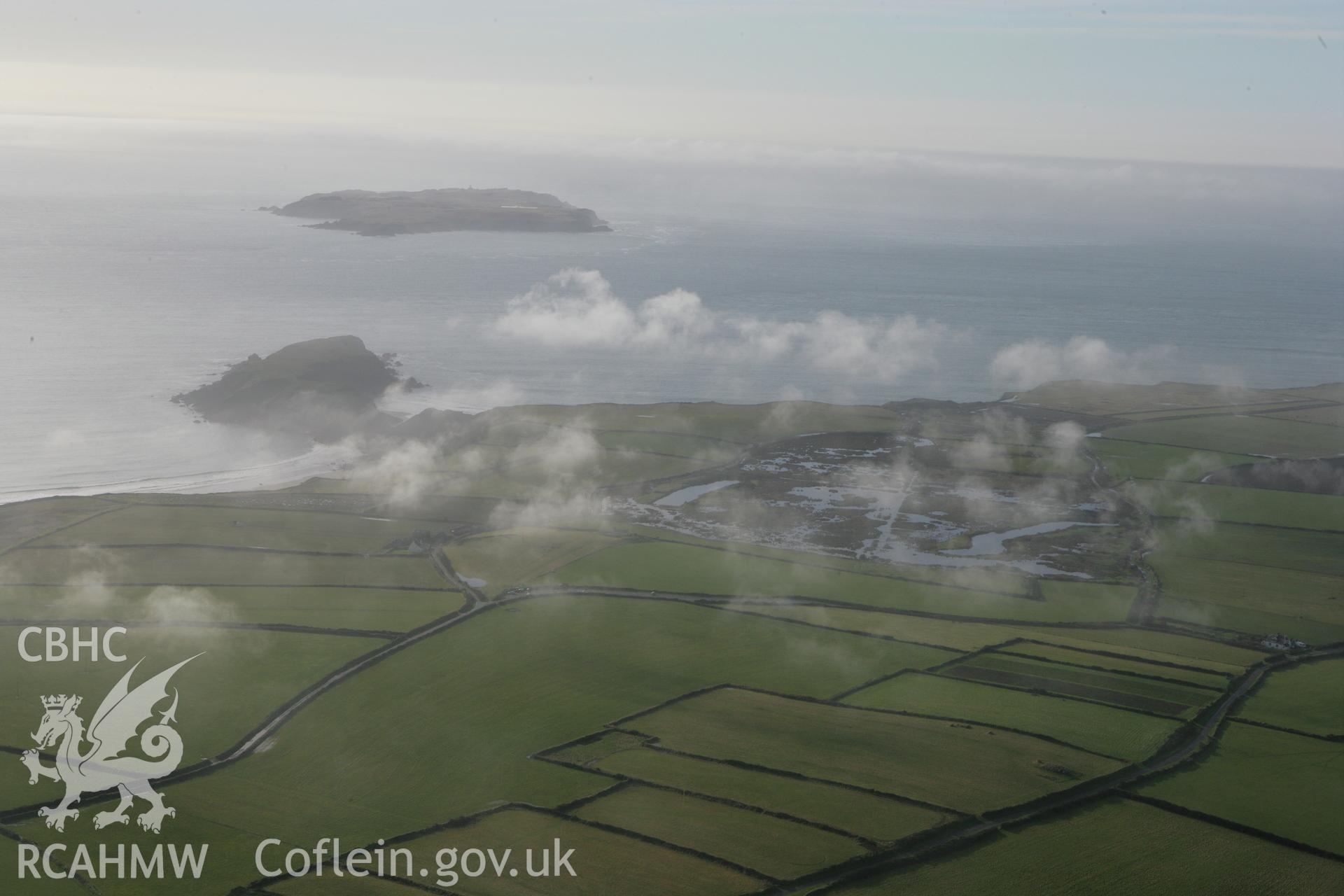 RCAHMW colour oblique aerial photograph of Skokholm Island. A distant landscape shot. Taken on 28 January 2009 by Toby Driver