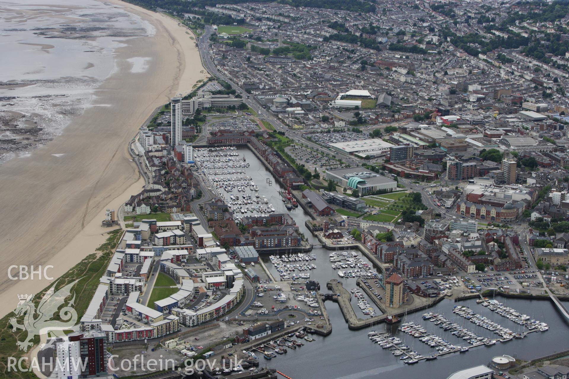 RCAHMW colour oblique aerial photograph of South Dock, now Swansea Marina. Taken on 09 July 2009 by Toby Driver