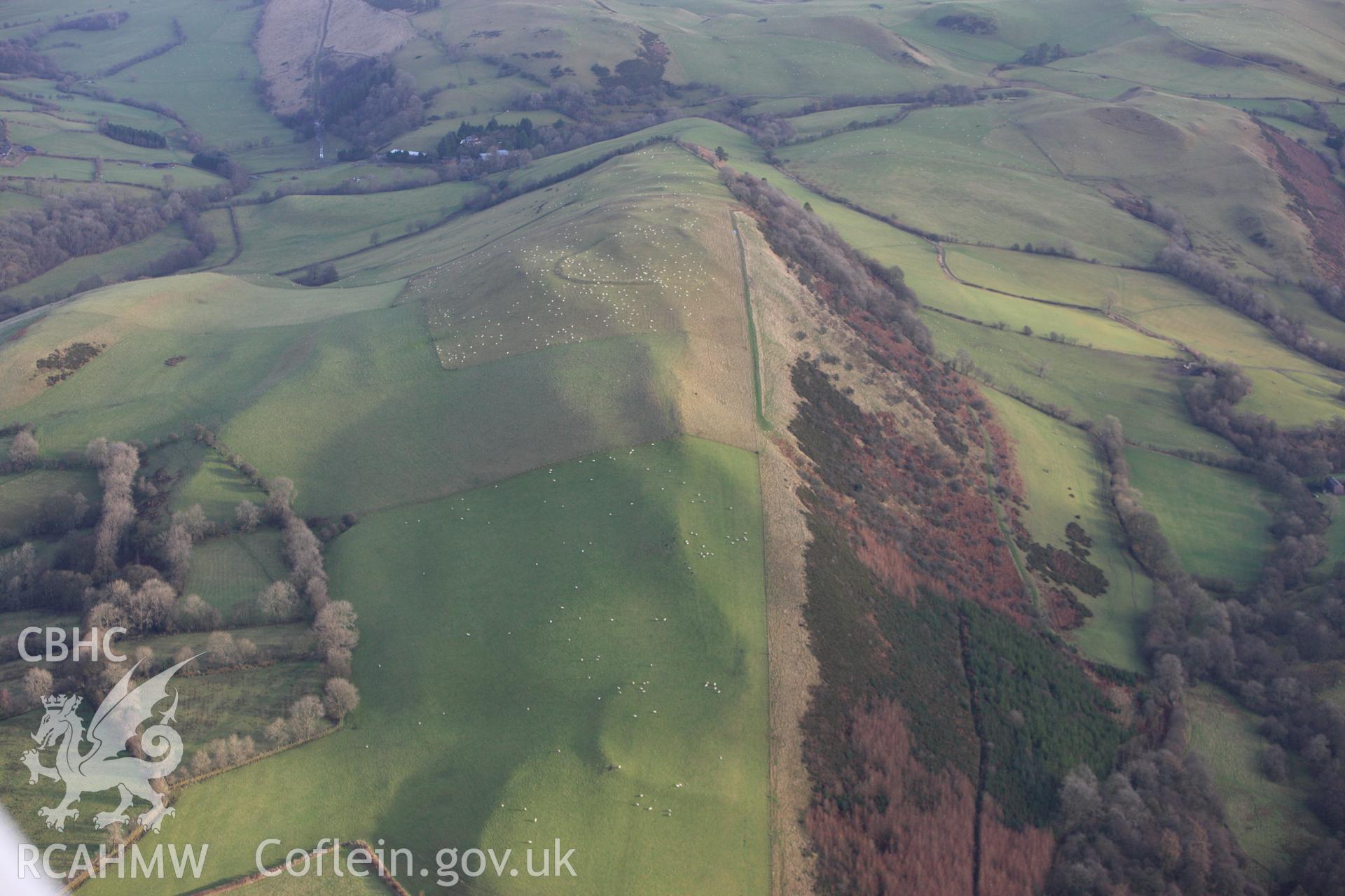 RCAHMW colour oblique aerial photograph of Llyssin Hill Hillfort and Crossdykes. Taken on 10 December 2009 by Toby Driver