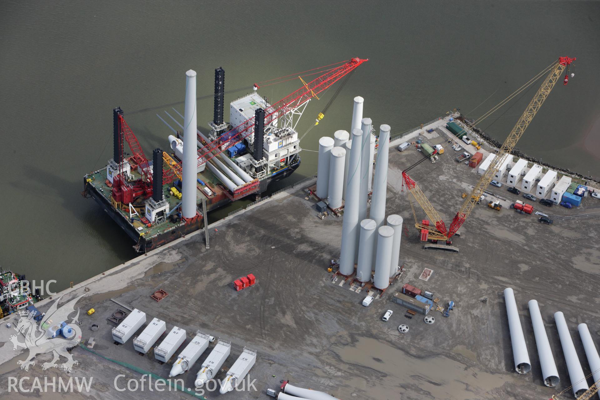 RCAHMW colour oblique aerial photograph of Mostyn Quay, with wind turbines. Taken on 30 July 2009 by Toby Driver