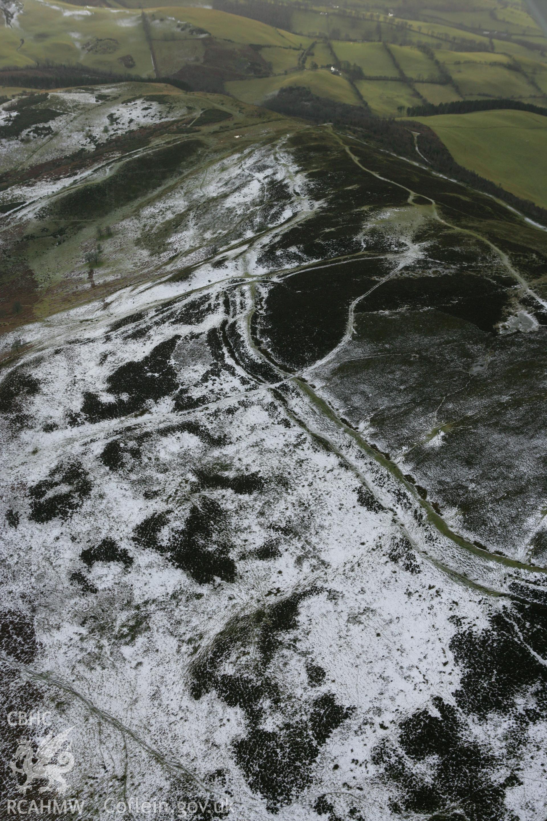 RCAHMW colour oblique photograph of Penycloddiau hillfort, winter landscape. Taken by Toby Driver on 21/01/2009.