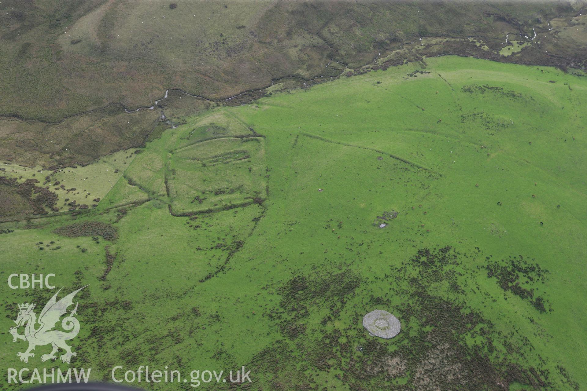 RCAHMW colour oblique aerial photograph of Hen Ddinbych and cairn Taken on 13 October 2009 by Toby Driver