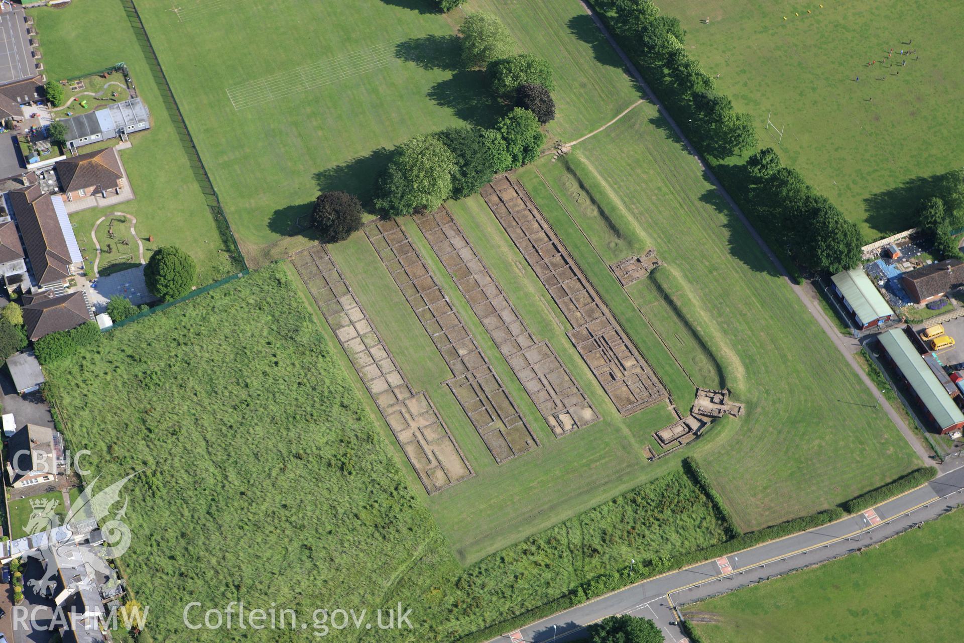 RCAHMW colour oblique aerial photograph of Roman Barracks, Prysg Field, Caerleon. Taken on 11 June 2009 by Toby Driver