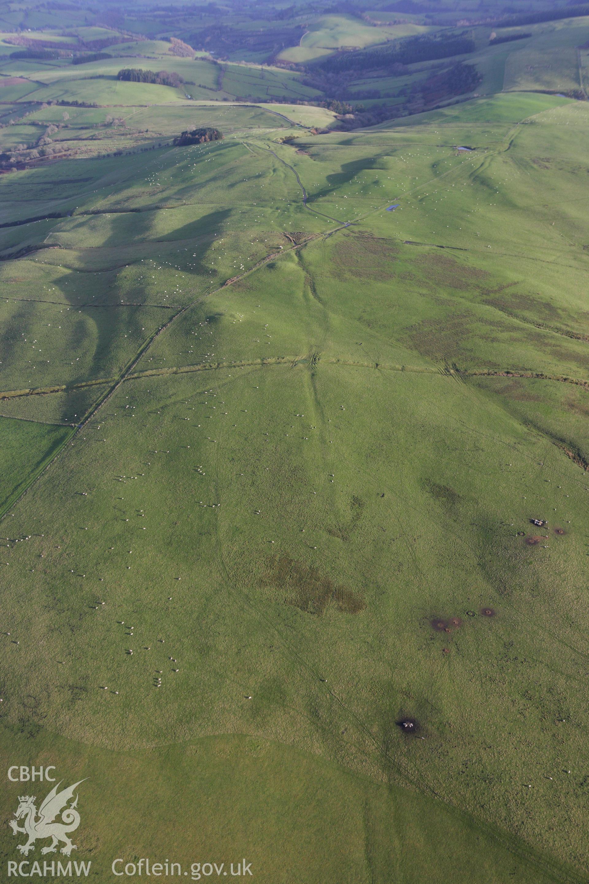 RCAHMW colour oblique aerial photograph of braided trackways on Kerry Hill. An old road crossing Two Tumps. Taken on 10 December 2009 by Toby Driver