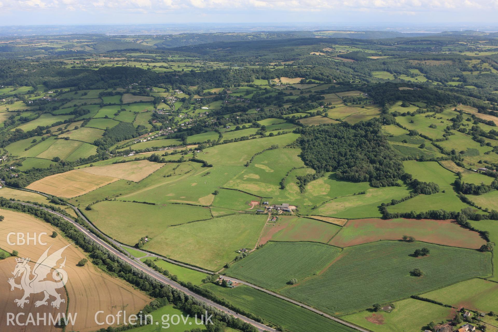 RCAHMW colour oblique aerial photograph of the site of a battle at Craig-y-Dorth, near Monmouth, from the north. Taken on 23 July 2009 by Toby Driver