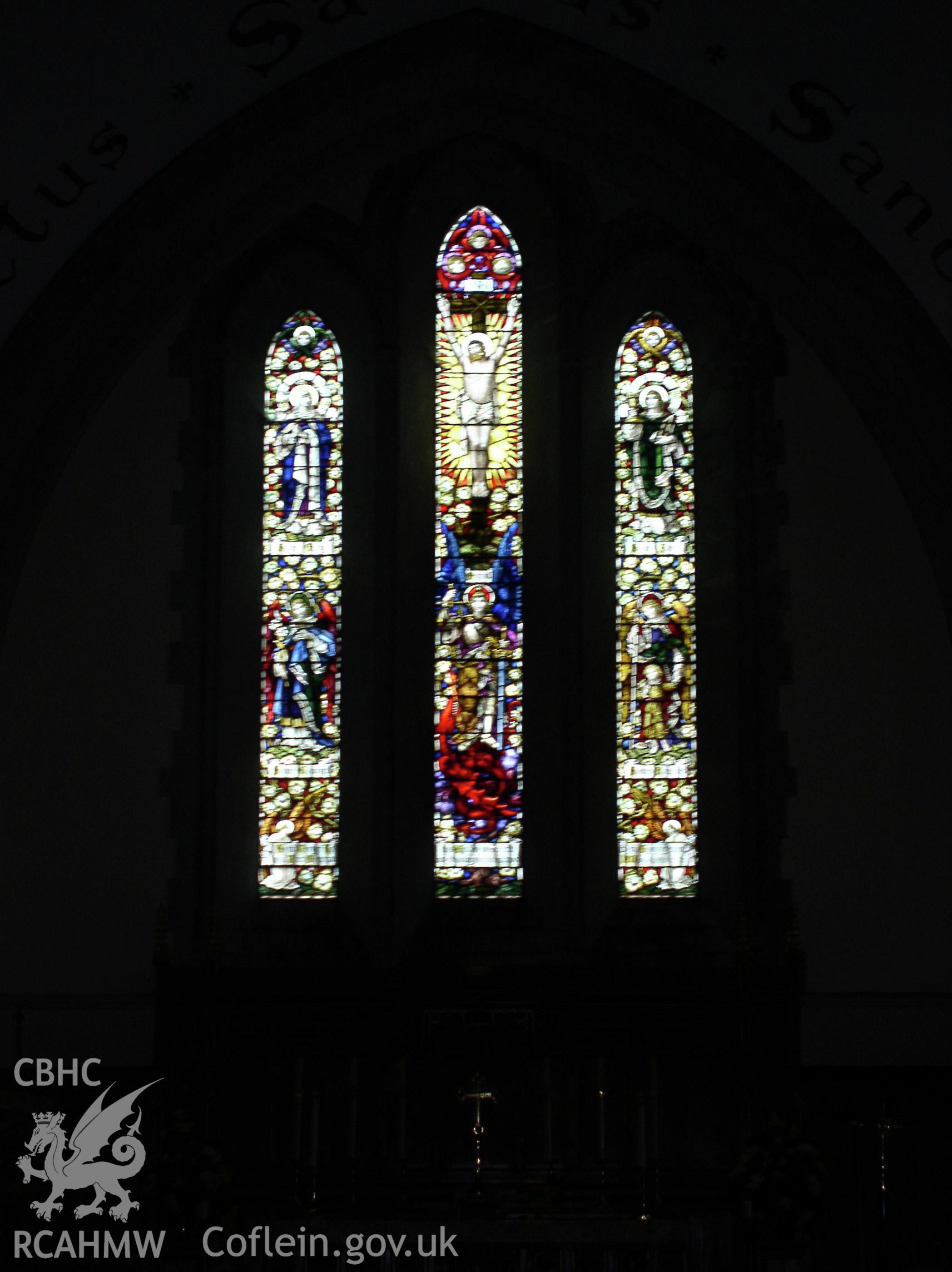 Colour digital photograph showing a stained glass window at St Michael and All Angel's Church, Maesteg; Glamorgan.