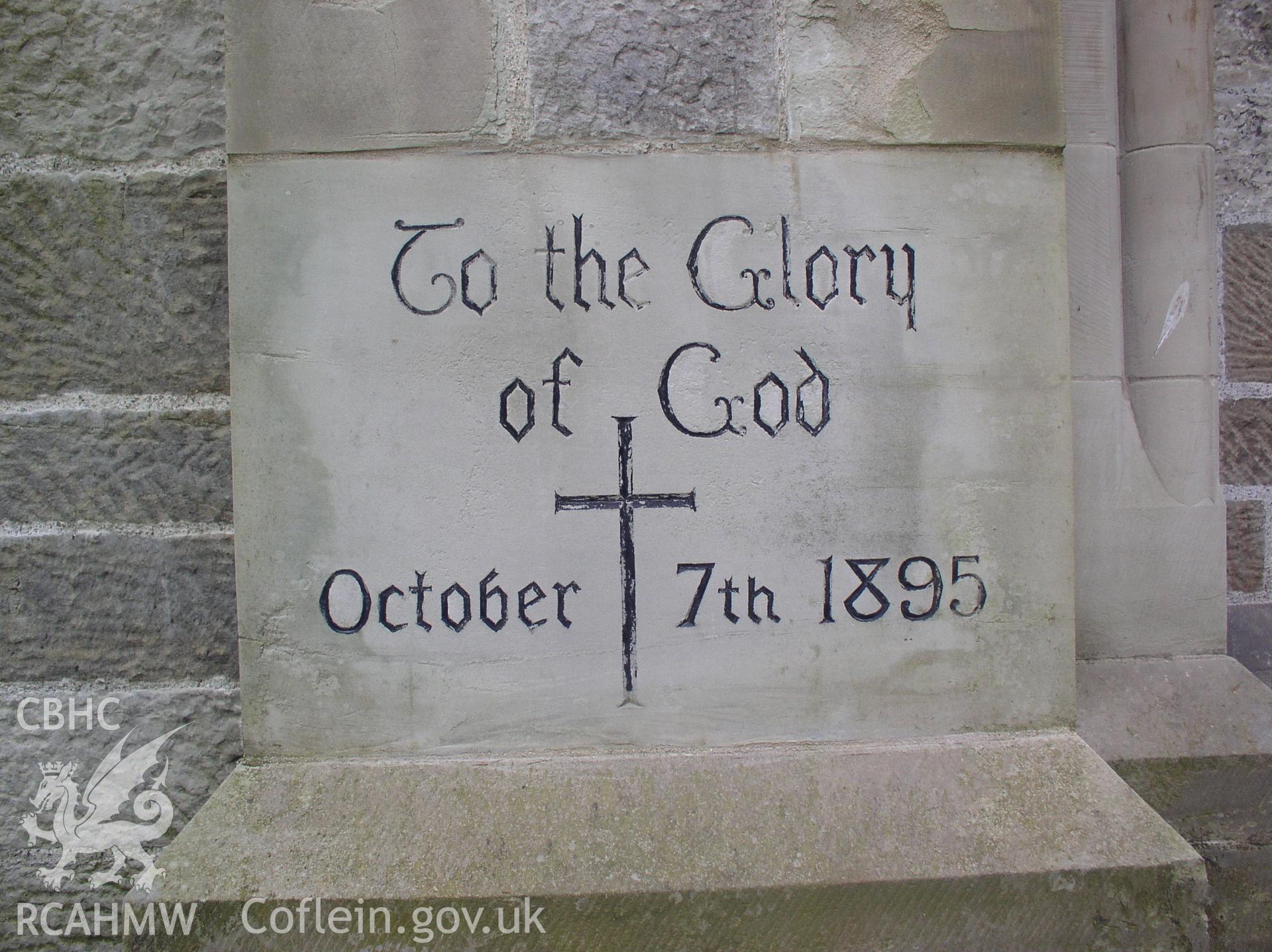 Colour digital photograph showing an engraving on an exterior wall at St Michael and All Angel's Church, Maesteg; Glamorgan. The inscription reads, "To the glory of God. October 7th 1895."